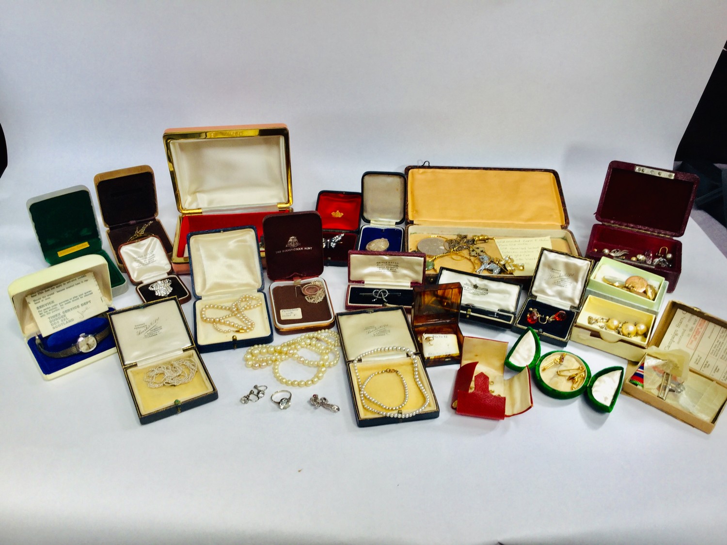 A selection of costume jewellery including various rolled gold lockets etc and brooches and rings
