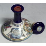 A British Navy Pusser's Rum Wade ceramic decanter and stopper, wax seal intact, 1 litre, 95.5 proof