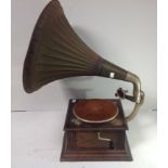 An oak cased HMV gramophone, with original green painted metal horn