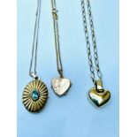 Three 9ct yellow gold locket pendants on chains, total weight 11.5 grams.