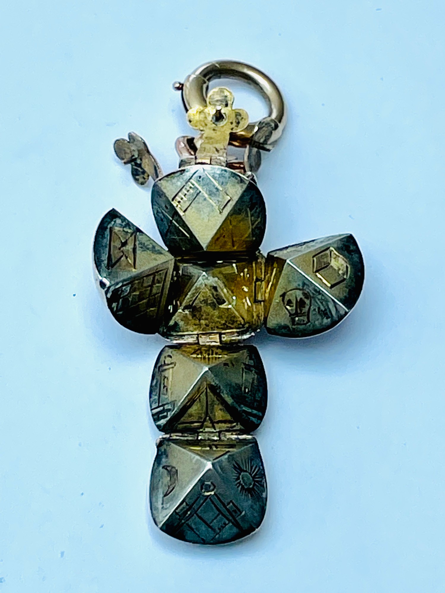 A 9ct gold and silver Masonic orb pendant, hinges open into the form of a cross, the internal - Image 2 of 3