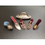 A selection of miniature pin cushions including two right shoes with claret cushions and heart
