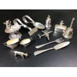 A quantity of small silver and white metal items including a silver spoon & pusher, silver tooth