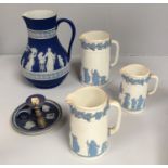 A set of three graduated Wedgwood Embossed Queen's Ware jugs, together with a Jasper dip large