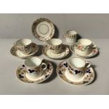 A Derby porcelain coffee can and saucer, 'roses and swags' (iron red mark), two fluted cups and
