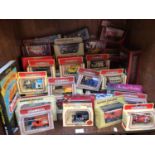 SECTION 54. A collection of approximately 50 assorted boxed die-cast model vehicles, predominantly