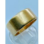 An 18ct yellow gold wedding ring, measuring 10mm, weight 13.9 grams, finger size W.