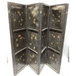 An Oriental changing screen with hand painted floral panels on one side and gilt painted bird scenes