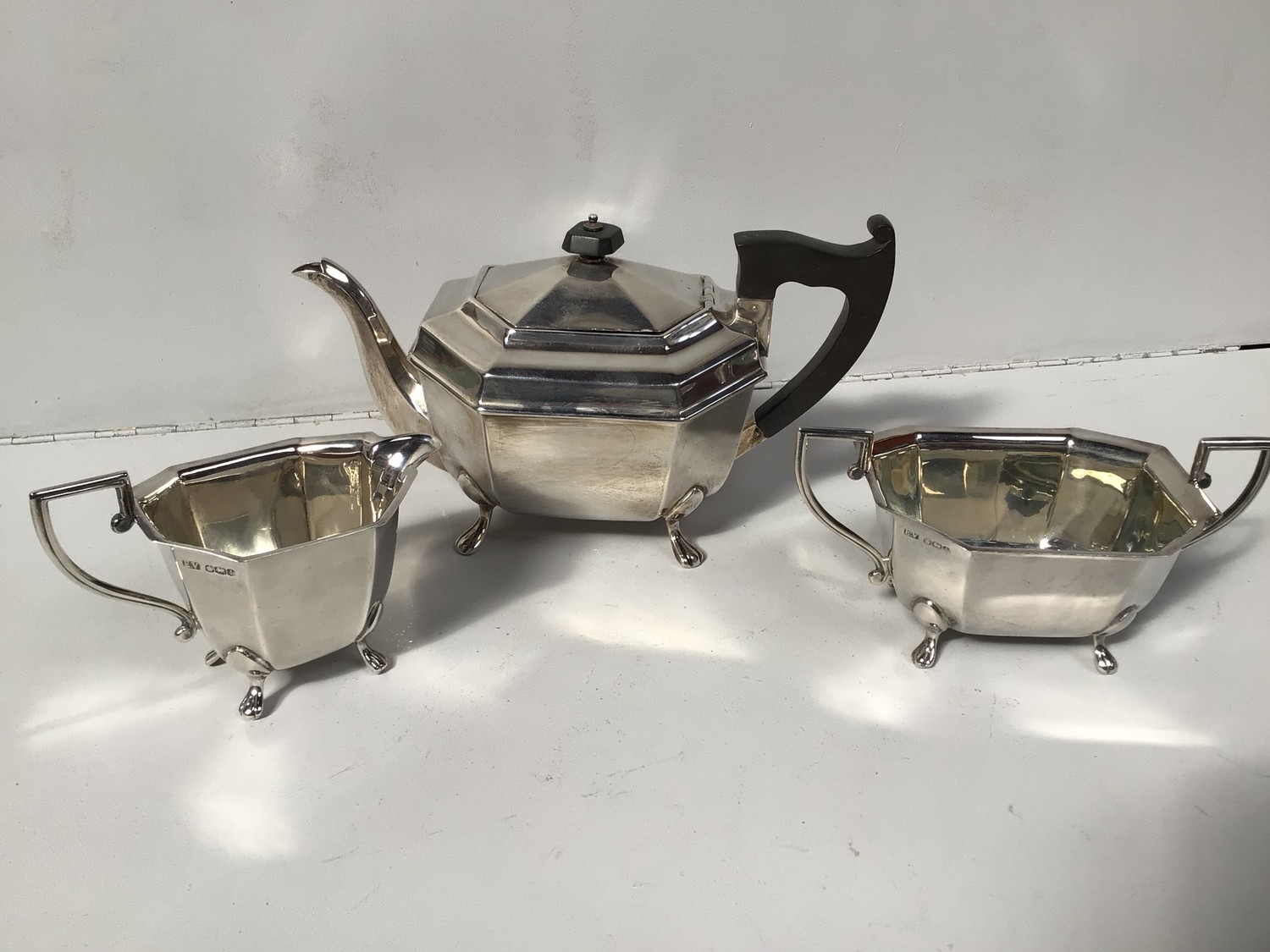 A three-piece silver tea set by Viner's Ltd, of octagonal form, comprising teapot, two-handled sugar