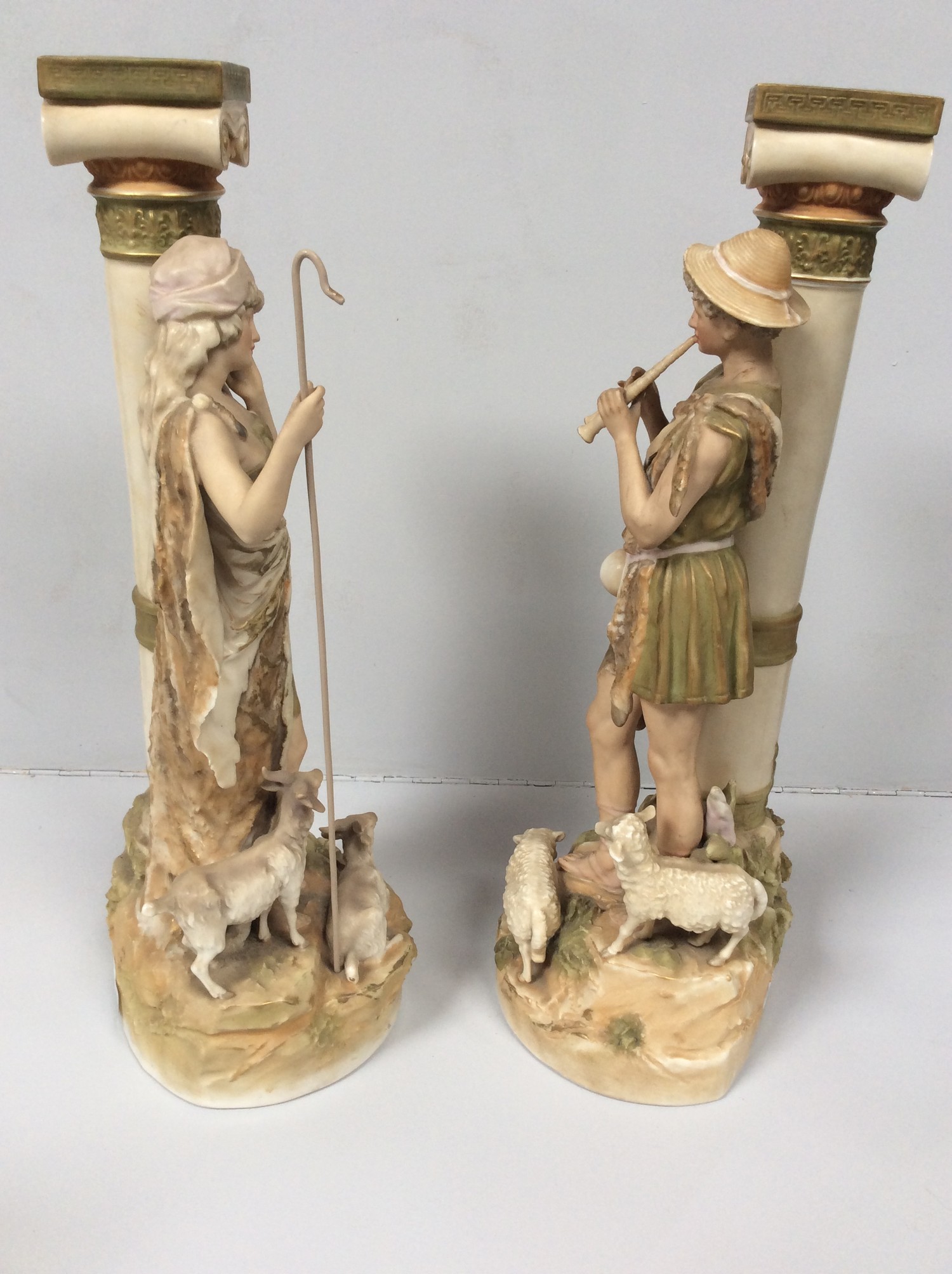 A pair of Royal Dux porcelain figures of a shepherd and shepherdess modelled next to classical Ionic - Image 2 of 5