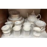 SECTION 18. A Royal Albert 'Memory Lane' pattern bone china six place dinner service comprising cups