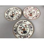 Three ceramic plates with similar gilded and painted floral designs, two Coalport examples and one