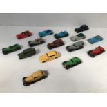 A collection of 15 assorted playworn die-cast Dinky cars comprising an Armstrong Siddeley's in red
