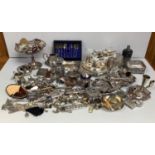 A large quantity of silver-plated items including flatware, tray, vases, dishes, napkin holders,