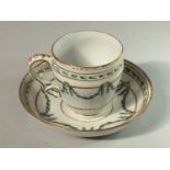 A Bristol Porcelain coffee cup and saucer, ogee shaped cup, decorated with gilding and green
