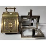 A Victorian brass coal scuttle with ornate handle to the top, decorative pull up flap and