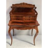 A French style kingwood writing desk with rosewood inlay, scrolled back top with shelf supported