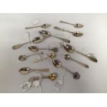 A small collection of assorted silver spoons including some Georgian and Victorian examples,