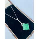 A white metal diamond and jade Art Deco necklace, in fitted box, inscribed Henry Simpson Ltd,