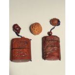 A Japanese 'Thousand faces' carved walnut shell, together with two various stained cherrywood