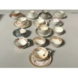 A collection of English 18th and 19th century porcelain tea wares, including pairs, trios, Derby and