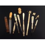 a small collection of Japanese bone-carved pen/letter openers, a crucifix, two pairs of miniature