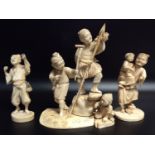 Three various Japanese Meiji period carved ivory Okimono figure groups, 18cm high the tallest, (as