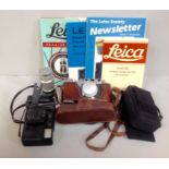 A Leica D.R.P. Ernst Leitz Wetzlar camera, No. 283336, in original brown leather case, together with