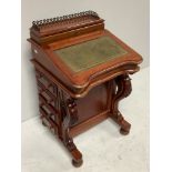 A reproduction stained mahogany Davenport desk, the raised back with three-quarter galleried top and