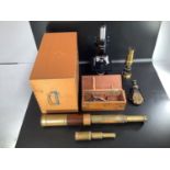 A three drawer brass and rosewood telescope engraved T C Heath Plymouth, complete with end cap and