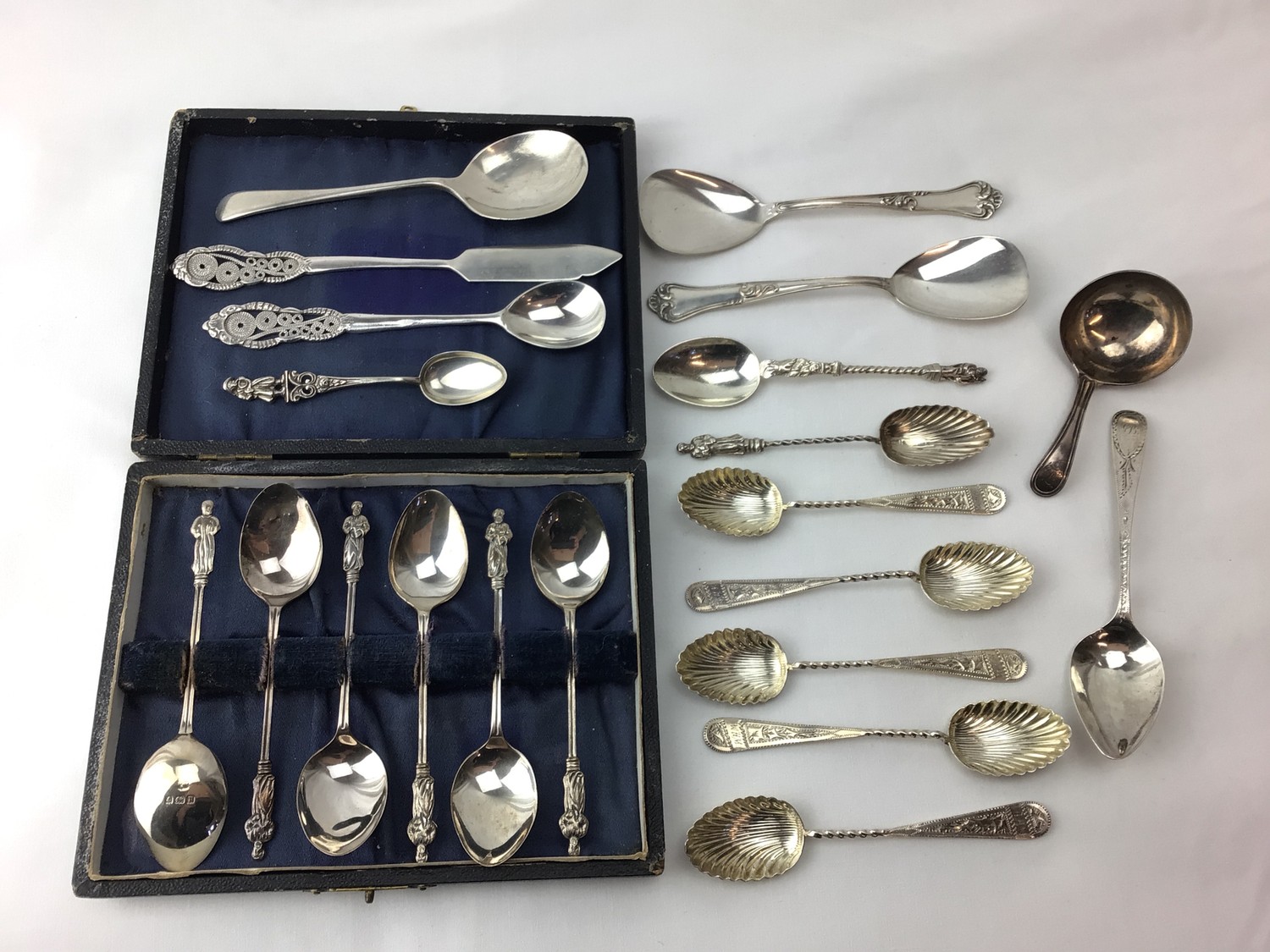 Various silver spoons including a cased set of six silver apostle coffee spoons, approx. gross