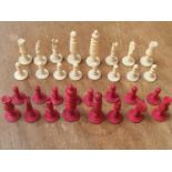 A turned, carved and stained bone chess set, 32 pieces, in wooden box