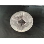 A small Lalique glass dish, with stylised floral centre and frosted horizontal, reeded decoration to