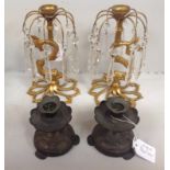 A pair of Regency gilt bronze lustres, raised on stylised dolphin bases to hand cut splayed and