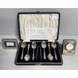 A cased set of six George VI silver coffee spoons and sugar tongs in fitted case, together with a