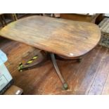 A 19th century rectangular mahogany single pedestal dining table with canted corners, raised on