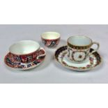 A Worcester porcelain trio in the 'Queen Charlotte' spiral pattern, and a Worcester 'reeded'