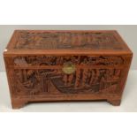 An oriental hardwood coffer with camphor lining carved with boat scenes to all four sides and top,