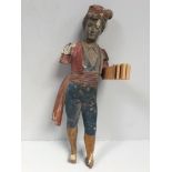 An original early 20th century carved and painted 'fairground' figure of a Turkish boy (for