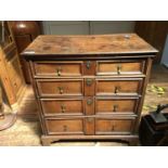 A late 17th century oak chest of two short, over three long graduated drawers with original brass