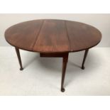 A 19th century oval mahogany drop-leaf gate leg table with tapered legs and pad feet, 132cm long,