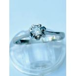 A white gold solitaire diamond ring, set with a round brilliant cut diamond in a six claw setting,