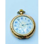 A 14ct gold ladies pocket watch with engraved back case, weight 5.0 grams.