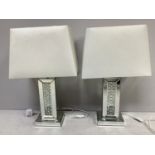 A pair of rectangular mirrored table lamps with central columns of crystals, with white