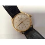 An 18ct gold International Watch Company wristwatch c.1960's, the cream dial with applied gold