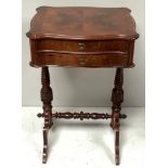 A Victorian and later-restored ladies two-drawer work-table with shaped top, opening to reveal a