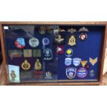 A collection of 33 embroidered cloth British military and US Police badges, including Royal Marines,