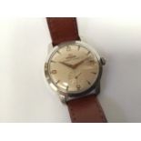 A gents stainless steel Lemania automatic wristwatch, the silvered dial with gilt batons,