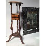 A mahogany jardinière stand, with two drawers and under-tier, raised on three down-swept supports,