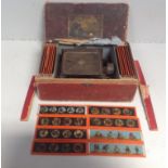 A 19th century boxed GBN tin Plate Magic Lantern, together with various assorted slides